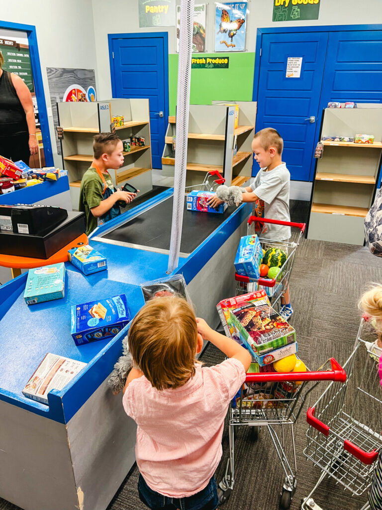 Kids playing in Grocery Store Exhibit at Wise Wonders, Billings