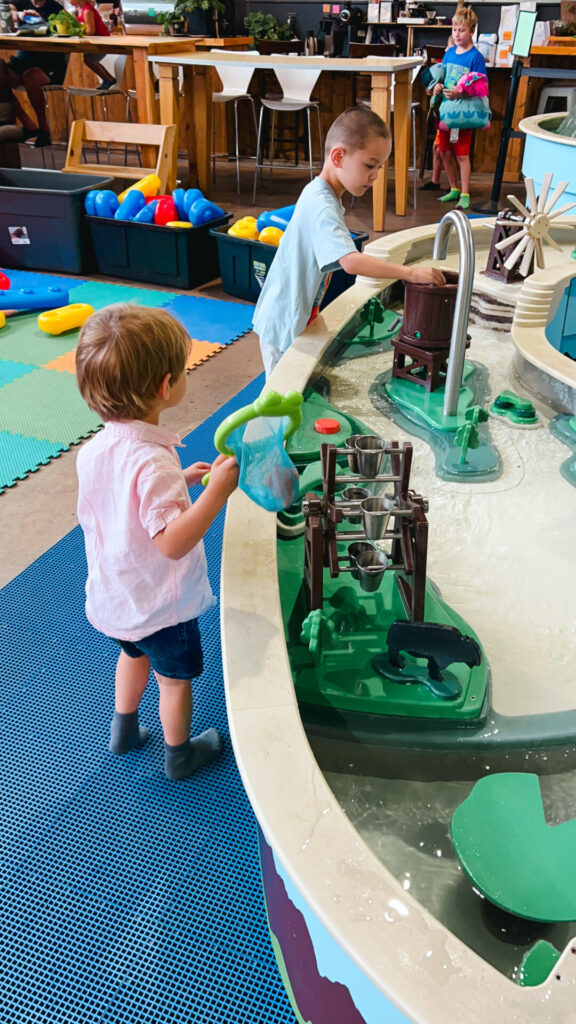 Kids play in water exhibit in Wise Wonders Museum in Billings